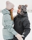 Portrait of smiling couple in love looking at each other. Young happy couple walking in winter Royalty Free Stock Photo