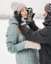 Portrait of smiling couple in love looking at each other. Young happy couple walking in winter Royalty Free Stock Photo