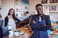 Portrait Of Smiling Couple Running Coffee Shop Together Standing Behind Counter Royalty Free Stock Photo