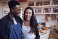 Portrait Of Smiling Couple Running Coffee Shop Together Standing Behind Counter Royalty Free Stock Photo