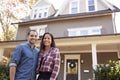 Portrait Of Smiling Couple Standing In Front Of Their Home Royalty Free Stock Photo