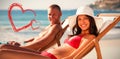 portrait of smiling couple on their deck chairs Royalty Free Stock Photo