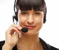 Portrait of smiling customer support female phone worker, over w Royalty Free Stock Photo