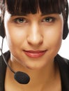 Portrait of smiling customer support female phone worker, over w Royalty Free Stock Photo