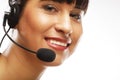 Portrait of smiling customer support female phone worker, over w Royalty Free Stock Photo