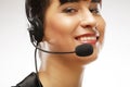 Portrait of smiling customer support female phone worker, over w Royalty Free Stock Photo