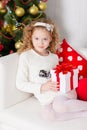 Portrait of smiling cute girl with Christmas gift