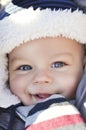 Portrait of smiling cute little baby boy wearing warm winter hat Royalty Free Stock Photo