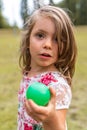 Portrait of smiling cute little girl playing with an old tennis racket Royalty Free Stock Photo