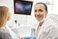 Portrait of smiling dentist at work Royalty Free Stock Photo