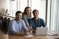 Portrait of smiling diverse businesspeople cooperate on computer Royalty Free Stock Photo