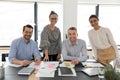 Portrait of smiling diverse colleagues posing in office Royalty Free Stock Photo