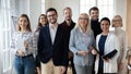 Portrait of smiling diverse team posing together in office Royalty Free Stock Photo