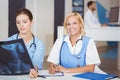 Portrait of smiling doctor with colleague examining X-ray Royalty Free Stock Photo