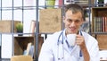 portrait of smiling doctor having a coffee break in the staff room