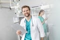 Portrait of smiling doctor holding clipboard while standing against coworker at veterinary clinic Royalty Free Stock Photo