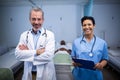 Portrait of smiling doctor and nurse in ward Royalty Free Stock Photo