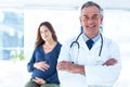 Portrait of smiling doctor with pregnant woman at clinic Royalty Free Stock Photo