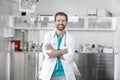 Portrait of smiling doctor standing with arms crossed at veterinary clinic Royalty Free Stock Photo