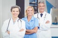 Portrait of smiling doctor team standing with arms crossed Royalty Free Stock Photo