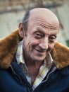 Portrait of a smiling elderly man outdoors closeup Royalty Free Stock Photo