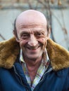 Portrait of a smiling elderly man outdoors closeup Royalty Free Stock Photo