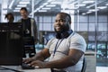 Portrait of smiling engineer in data center optimizing IT infrastructure