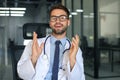 Portrait of smiling excited doctor in hospital