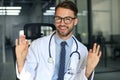 Portrait of smiling excited doctor in hospital