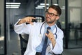 Portrait of smiling excited doctor in hospital