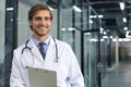 Portrait of smiling excited doctor in hospital