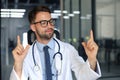 Portrait of smiling excited doctor in hospital