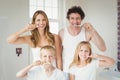 Portrait of smiling family brushing teeth Royalty Free Stock Photo