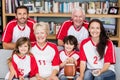 Portrait of smiling family with grandparents watching American football match Royalty Free Stock Photo