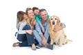 Portrait of smiling family sitting together with their dog Royalty Free Stock Photo