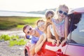 Portrait of a smiling family with two children at beach in the c Royalty Free Stock Photo