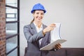 Portrait of smiling female architect holding clipboard Royalty Free Stock Photo