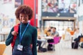 Portrait Of Smiling Female College Student In Busy Communal Campus Building Royalty Free Stock Photo