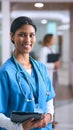 Portrait Of Smiling Female Doctor Or Nurse Wearing Scrubs And Stethoscope In Hospital Royalty Free Stock Photo