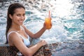 Happy lady tasting beverage in water Royalty Free Stock Photo