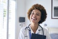 Portrait Of Smiling Female Nurse Wearing Uniform With Digital Tablet In Private Hospital Room Royalty Free Stock Photo