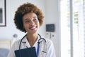 Portrait Of Smiling Female Nurse Wearing Uniform With Digital Tablet In Private Hospital Room Royalty Free Stock Photo