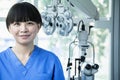 Portrait of smiling female optometrist with eye test equipment Royalty Free Stock Photo