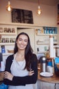 Portrait Of Smiling Female Owner Of Coffee Shop Standing Behind Counter Royalty Free Stock Photo