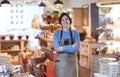 Portrait Of Smiling Female Owner Of Delicatessen Shop Wearing Apron