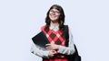 Portrait of smiling female student with laptop backpack, on light background Royalty Free Stock Photo