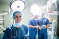 Portrait of smiling female surgeon standing in operation room Royalty Free Stock Photo