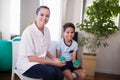 Portrait of smiling female therapist and boy holding stress balls Royalty Free Stock Photo