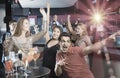 Portrait of smiling females and males having fun in the bar Royalty Free Stock Photo