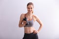 Fitness Woman Holding Protein Shaker Bottle